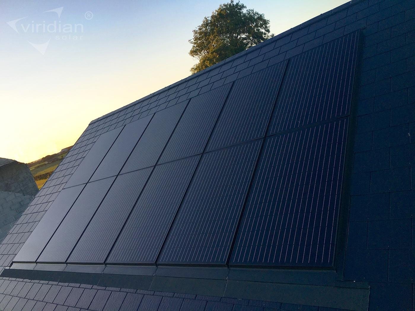 Solar panels on roof at sunset